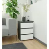 A modern living room setting with a sofa and a nightstand. Produktbild-Vorschau
