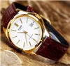 A close-up shot of a gold-colored Casio watch with a white face and a brown leather strap, resting on a textured brown surface. Anteprima dell’immagine prodotto