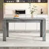 A dining table in a modern kitchen setting.