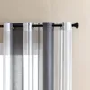 Close-up view of striped curtains hanging on a rod. Produktbild-Vorschau