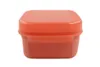 A front view of an orange plastic food storage container with a lid, isolated on a white background. Produktbild-Vorschau
