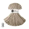 A spool of beige macrame cord with a label. Podgląd zdjęcia produktu
