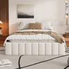 A modern bedroom with a bed, artwork, and a nightstand. Produktbild-Vorschau