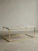 Moderner Couchtisch 100x60 cm freigestellt vor weißem Hintergrund, mit weißer Marmor-Optik Tischplatte und einem filigranen Gestell aus goldfarbenem Stahl._#sku_SAFWL6.606# Produktbild-Vorschau
