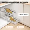 A chrome-plated pull-out cabinet organizer with two shelves, shown inside a kitchen cabinet. Podgląd zdjęcia produktu