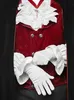 A close-up of a person wearing a vampire costume, focusing on the chest and hands. Produktbild-Vorschau