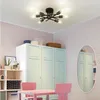 A room with a ceiling light, cabinets, shelves, and a table with chairs. Náhled obrázku produktu
