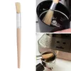 A collage showing a cleaning brush for coffee machines and grinders, with close-ups of its use. Produktbild-Vorschau