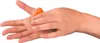 A person's hands are shown with an orange massage tool being applied to the palm of one hand. Voir les images du produit