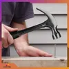 A person is using a hammer to hit a nail into a wooden plank. Produktbild-Vorschau