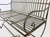 A close-up view of a metal garden bench. Produktbild-Vorschau
