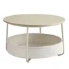 A round coffee table with a fabric storage basket underneath. Produktbild-Vorschau