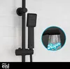 A black shower set mounted on a tiled wall, with a close-up inset showing water spraying from the showerhead. Produktbild-Vorschau