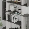 A close-up view of a modern gray and white bookshelf unit displaying various items. Produktbild-Vorschau