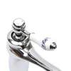 A close-up shot of a faucet handle and spout against a white background. Produktbild-Vorschau