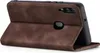 A brown flip case for a smartphone is shown from the back, propped open. Produktbild-Vorschau