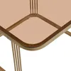 A close-up view of the corner of a table with a glass top and gold-colored metal legs. Náhľad obrázku produktu