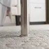 Close-up of a table leg on a carpet. Podgląd zdjęcia produktu