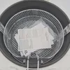 A close-up, top-down view of the interior of a deep fryer. Produktbild-Vorschau