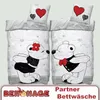 Two sets of bedding with teddy bears in a romantic pose, with hearts as a background pattern. There are also two pillows with heart designs. Produktbild-Vorschau