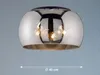 A ceiling lamp with a reflective, spherical shade. Produktbild-Vorschau