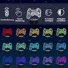 A collage of 3D illusion lamps shaped like game controllers, displayed in various colors against a starry night background. Produktbild-Vorschau