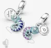 Two Pandora charms shaped like chameleons, one with blue and purple stripes, the other with blue and pink stripes, displayed on a white background. Anteprima dell’immagine prodotto