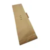 A brown paper vacuum cleaner bag is shown diagonally against a white background. Produktbild-Vorschau