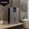 A Ruhhy dehumidifier is placed on a bathroom counter next to a sink and a vase with dried flowers. Anteprima dell’immagine prodotto