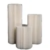 Three cylindrical stands of varying heights are arranged together. Podgląd zdjęcia produktu