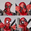 A collage of four close-up shots of a Deadpool action figure, showcasing different facial expressions and accessories. Podgląd zdjęcia produktu