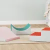 Three soft play blocks for children are arranged on a rug in a room with a crib in the background. Anteprima dell’immagine prodotto