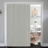 A room divider curtain is installed in a doorway, separating a living area from a dining area with a table and chairs. Náhľad obrázku produktu