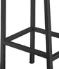 A close-up view of the black metal frame of a bar stool, showing the base and support structure. Podgląd zdjęcia produktu