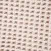 A close-up view of a beige waffle-weave fabric texture. Produktbild-Vorschau