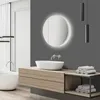 A modern bathroom with a freestanding bathtub, vanity with a vessel sink, and a backlit mirror. Anteprima dell’immagine prodotto