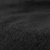 A close-up, textured view of black fabric. Voir les images du produit