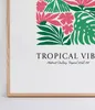 A close-up of a framed picture with tropical floral art and text. Anteprima dell’immagine prodotto