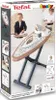 The image shows the product packaging for a Smoby Tefal ironing board with a steam station. The packaging features images of the product, a child playing with it, and various accessories. Produktbild-Vorschau