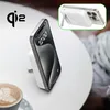 A white wireless charging stand with a smartphone attached is placed on a white table next to a cup of coffee. Voir les images du produit