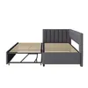 A grey upholstered bed frame with an extended slatted base, shown from the side against a white background. Produktbild-Vorschau