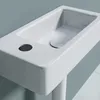 A close-up view of a white ceramic sink with a hole for a faucet and a drain. Anteprima dell’immagine prodotto
