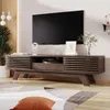 A modern living room with a TV stand and a large television. Produktbild-Vorschau
