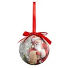 A Christmas ornament with Santa Claus on it, hanging from a red ribbon. Produktbild-Vorschau