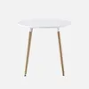 A round white table with three wooden legs against a white background. Anteprima dell’immagine prodotto