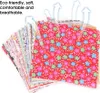 A stack of fabric squares with floral patterns, with arrows indicating breathability. Náhľad obrázku produktu