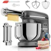 A kitchen mixer with various attachments and a slice of cake. Produktbild-Vorschau