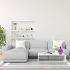 A modern living room with a gray sectional sofa, a white coffee table, and a decorative aroma diffuser. Voir les images du produit