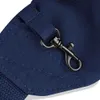 A close-up view of a dark blue fabric bag with a metal clasp. Anteprima dell’immagine prodotto