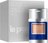 A product shot of a La Prairie Skin Caviar Concealer Foundation stick next to its packaging. Podgląd zdjęcia produktu
